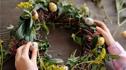close-up-little-girl-decorating-flower-wreath-with-quail-eggs-table.jpg
