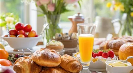 easter-brunch-items-including-pastries-fruits-beverages-set-against-festive-background.jpg